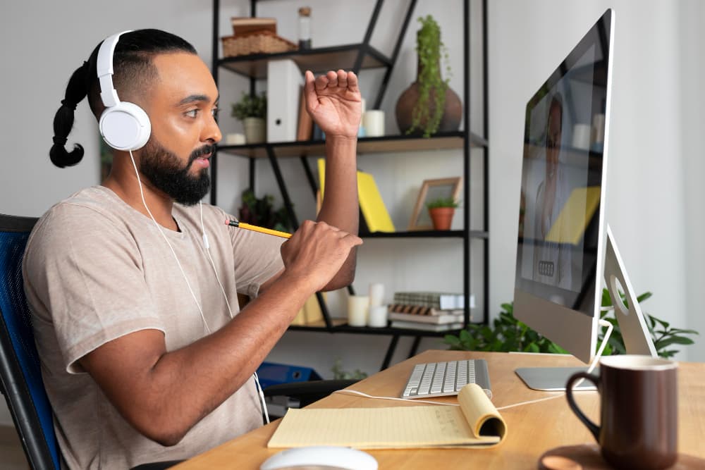 A support professional working remotely at a desk