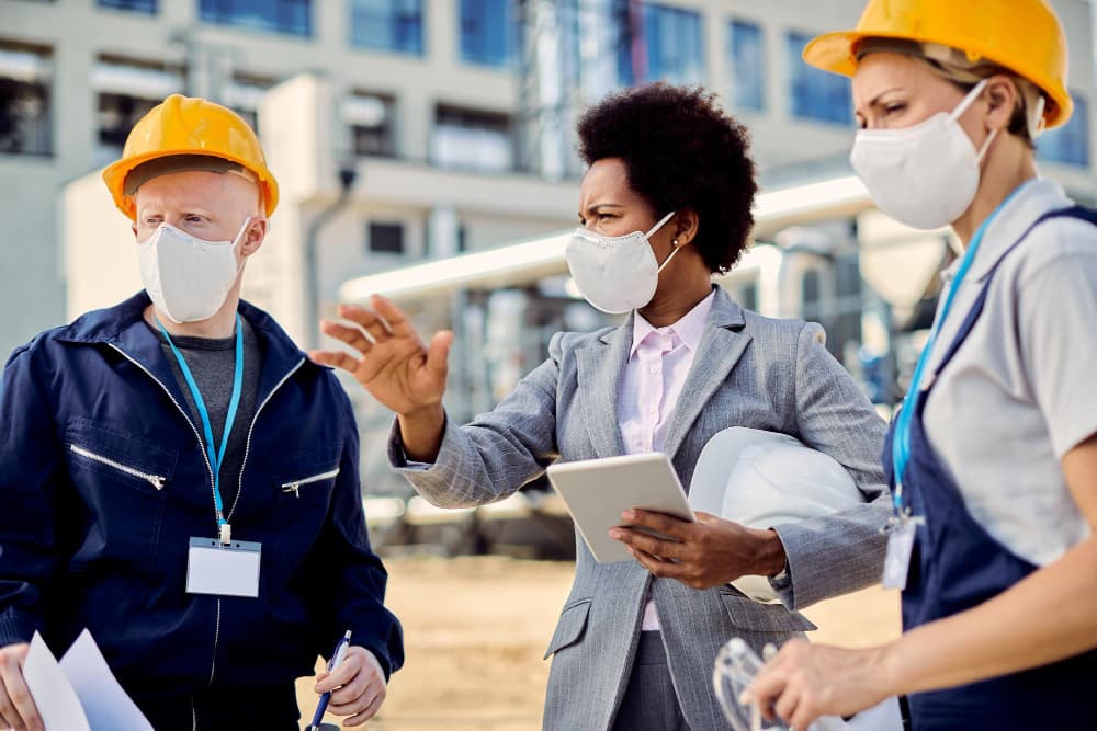 A project team reviewing progress together on site